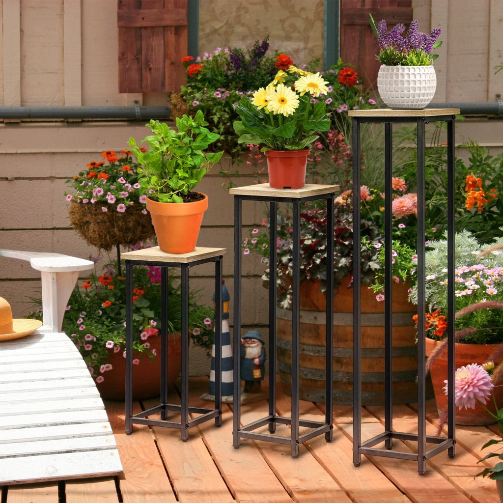 Set di 3 supporti per piante, sgabello e portavaso in acciaio, nero e naturale, per giardino e balcone.