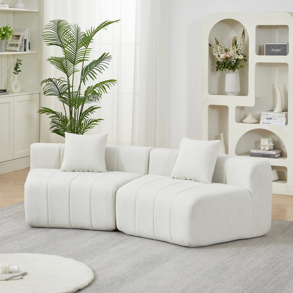 Divano modulare curvo con 2 cuscini e seduta ispirata ai tasti del pianoforte senza montaggio in ciniglia beige