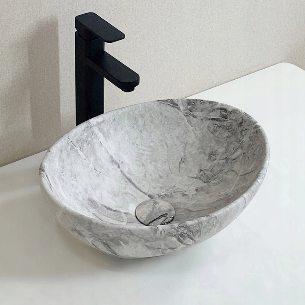 Lavabo da appoggio in ceramica da posizionare su piano in pietra grigia marmo rotondo